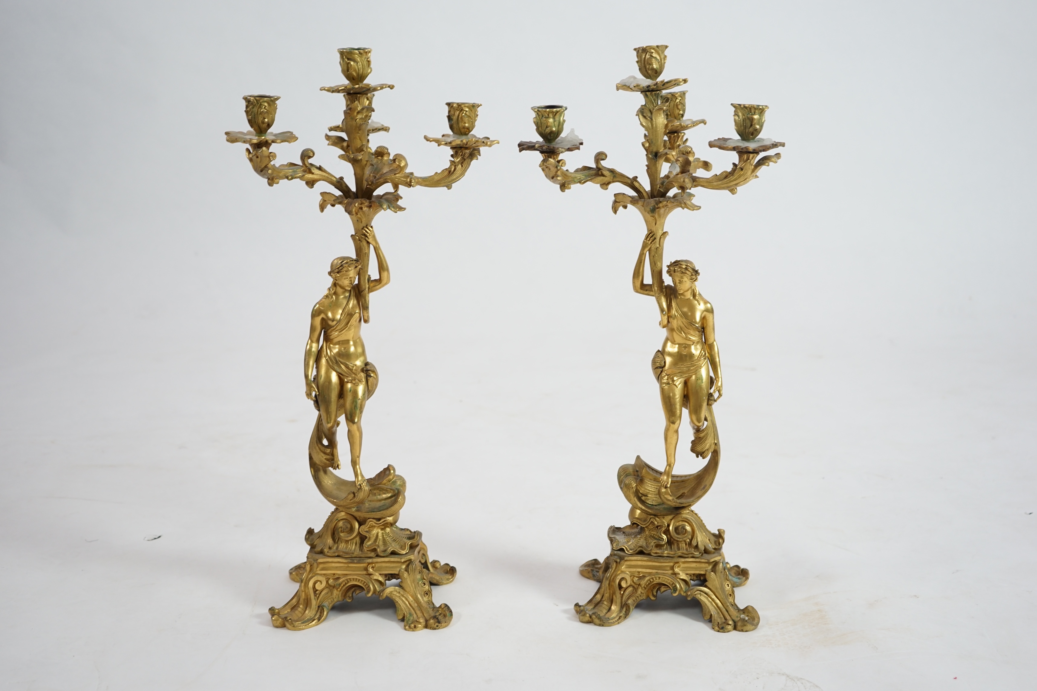 A pair of 19th century French ormolu five light ‘Venus’ figural candelabra